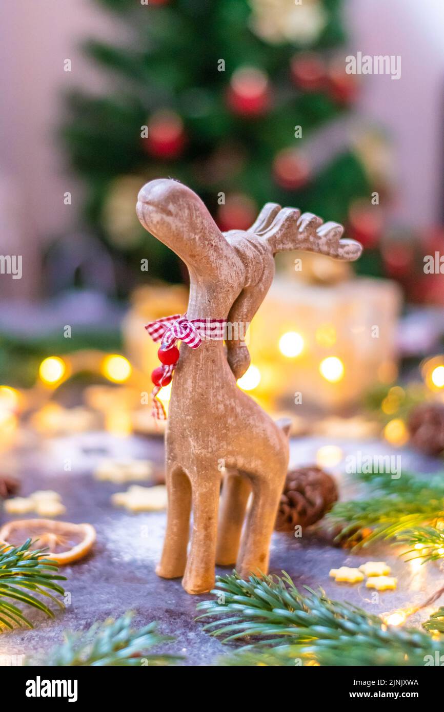 Christmas reindeer wooden toy statue with pine tree, cone and winter ...