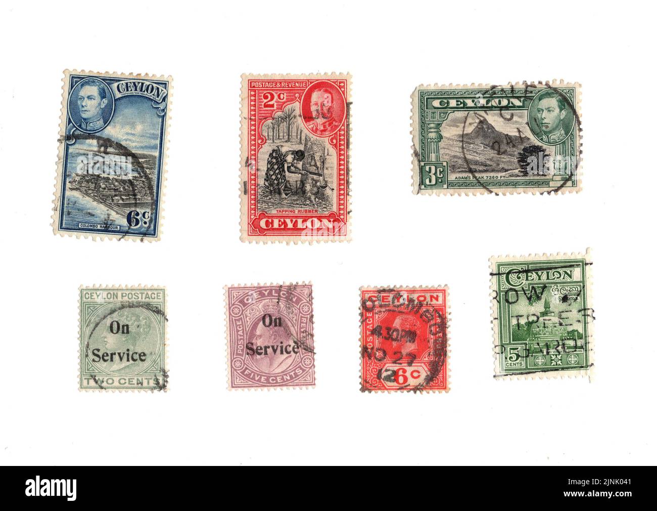A selection of old postage stamps from the Ceylon on a white background ...