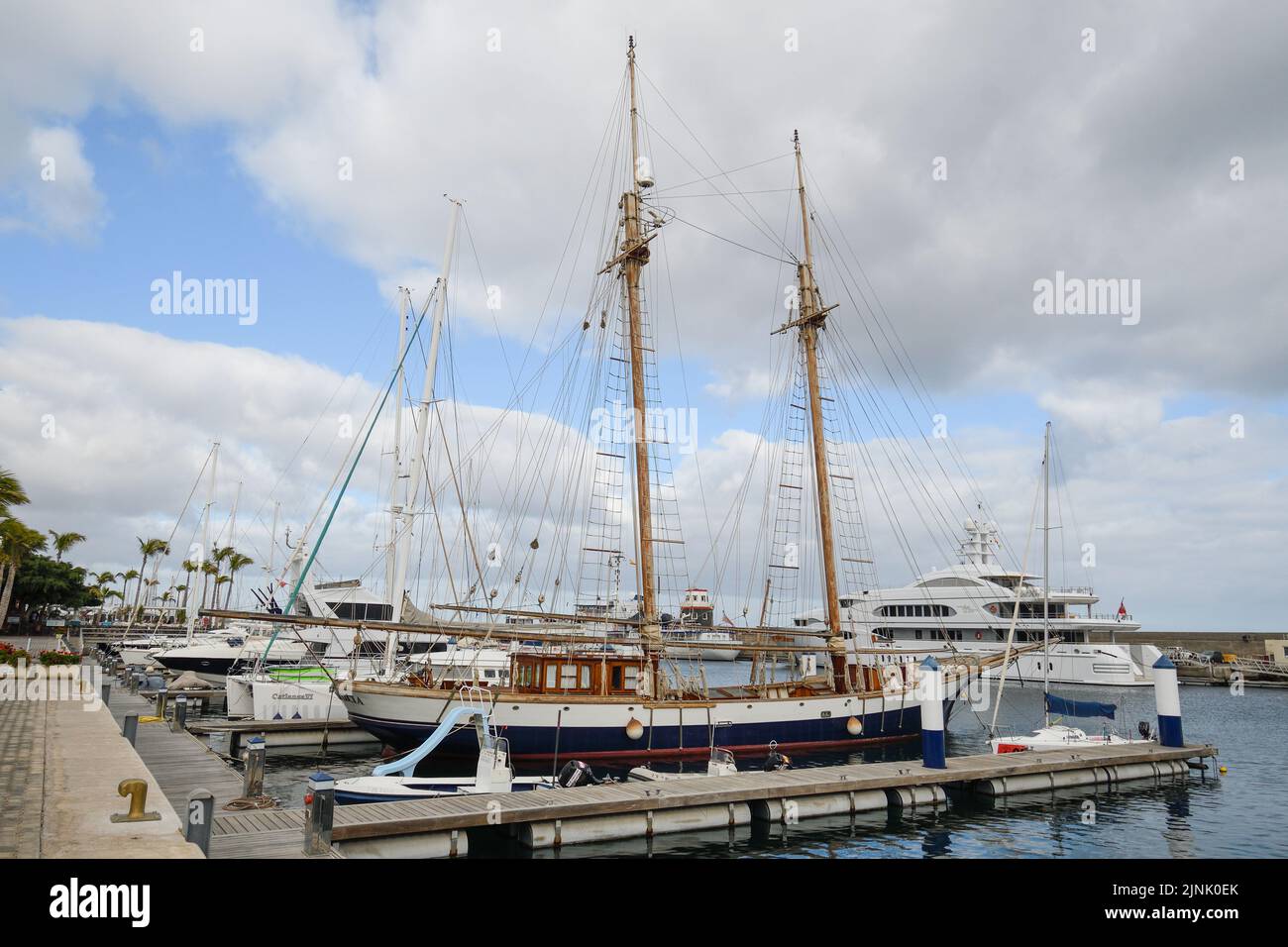 Puerto Calero marina in Lanzarote with a schooner in the foreground Stock Photo