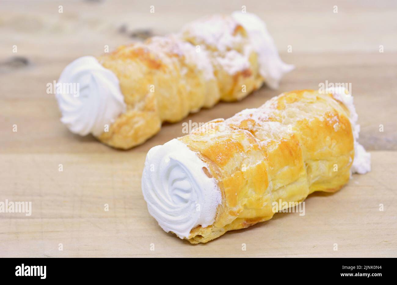 Sweet traditional czech baked crispy tube originally named Kremrole. Traditional Kremrole tube is filling with egg white snow. Stock Photo