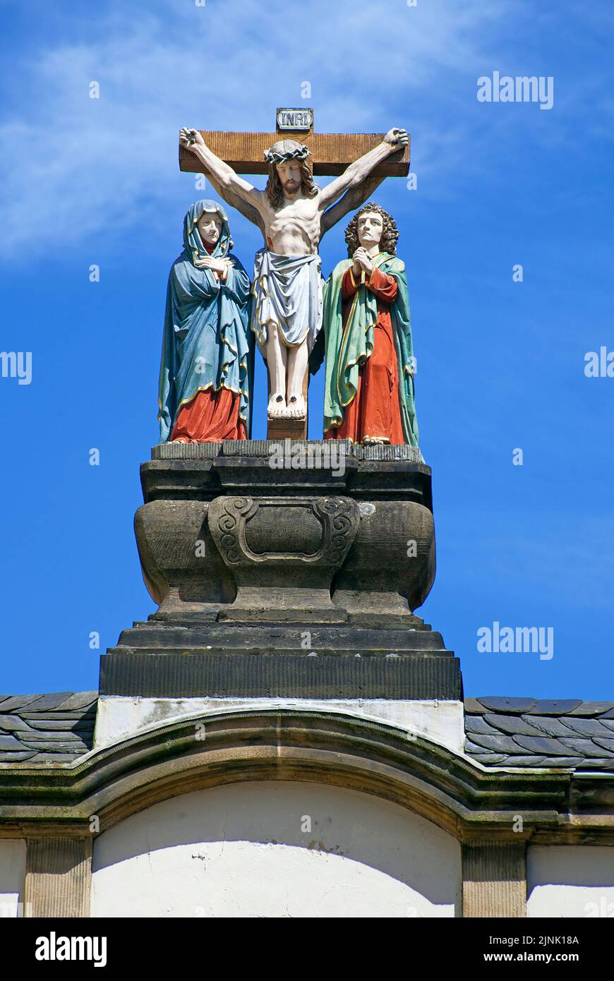 Crucifixion scene on a house arche at the Liebfrauen street, Trier, Rhineland-Palatinate, Germany, Europe Stock Photo