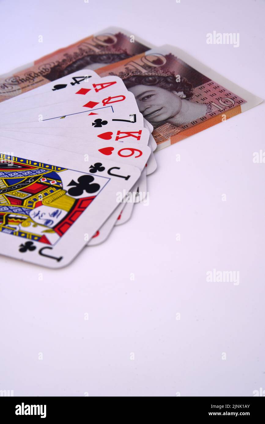 Playing cards and cash Stock Photo