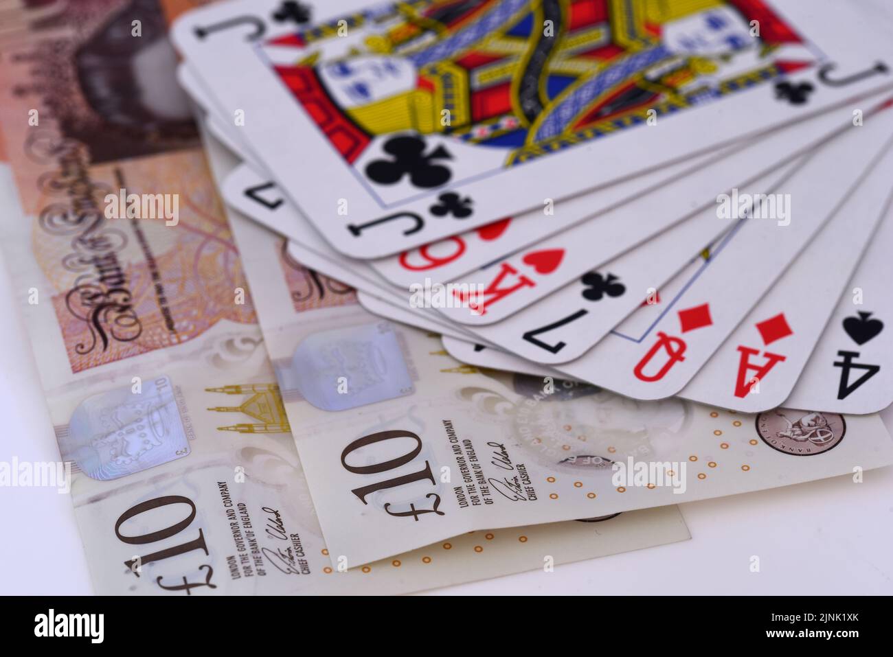 Playing cards and cash Stock Photo