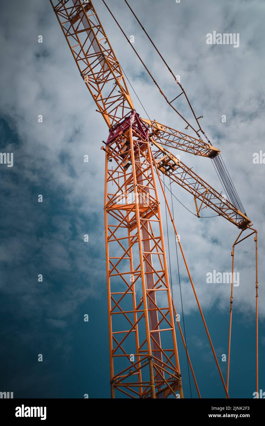 A vertical shot of the tower crane Stock Photo - Alamy
