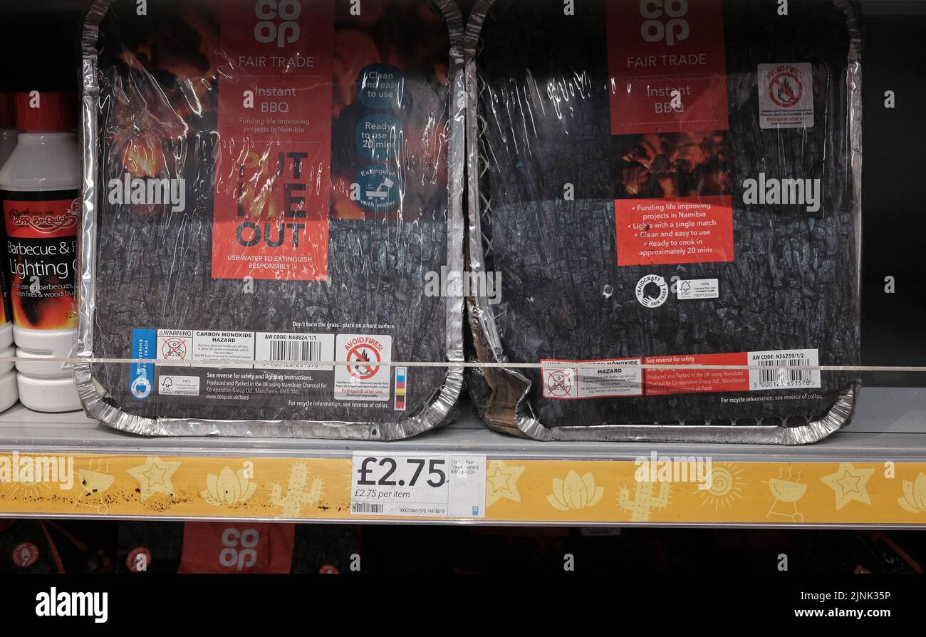 Instant barbecues on the shelves of a Co-op store in Walthamstow, east London. A drought is set to be declared for some parts of England on Friday, with temperatures to hit 35C making the country hotter than parts of the Caribbean. Picture date: Friday August 12, 2022. Stock Photo