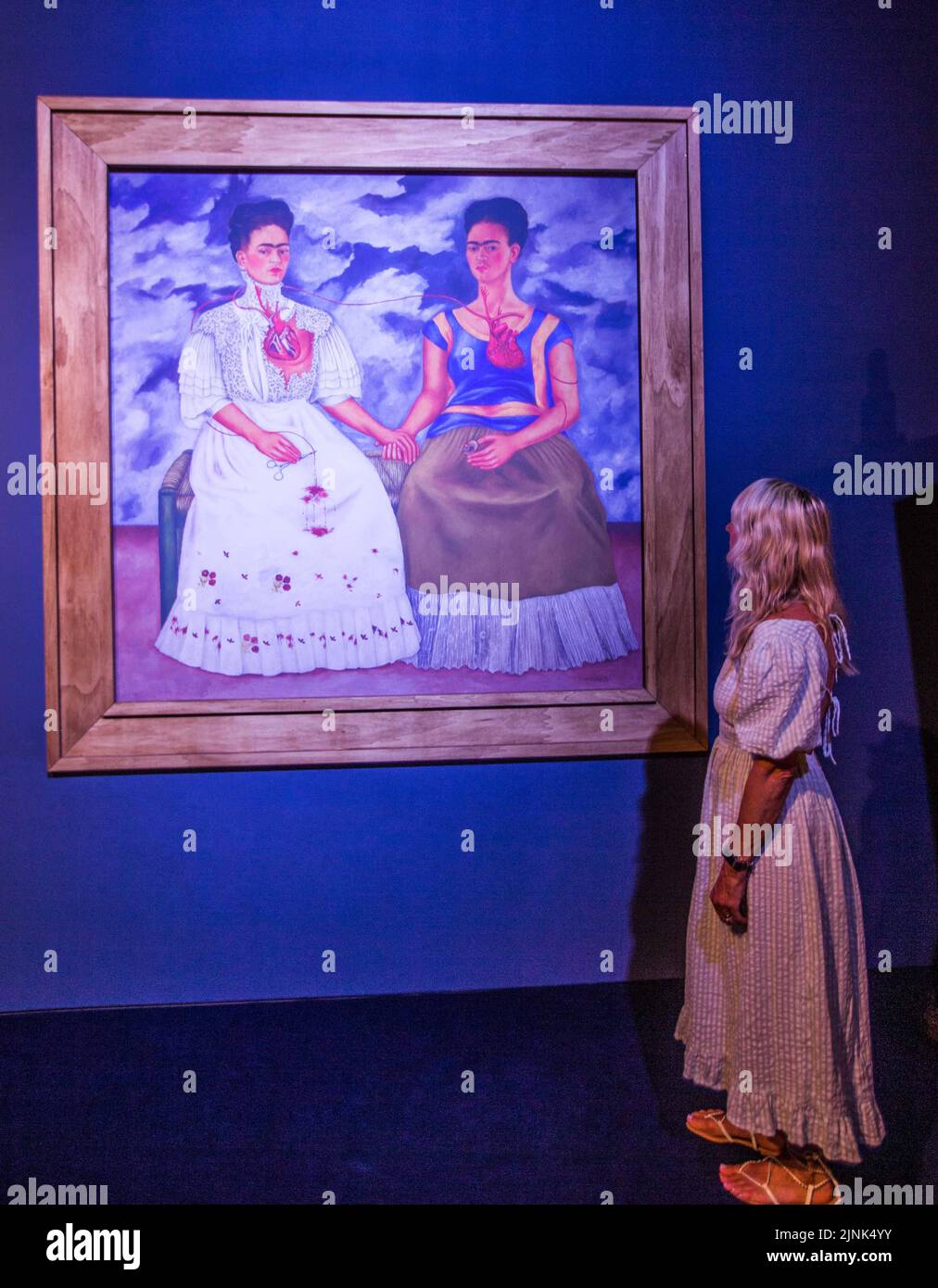 London UK 12 August 2021  Frida Kahlo and Diego Rivera, two of Mexico’s greatest ever painters. Their work captures beauty, love, and deep emotions, and you can see their paintings come to life at dazzling art. Dock X in Canada Water until end of October 2022.,Paul Quezada-Neiman/Alamy Live News Stock Photo