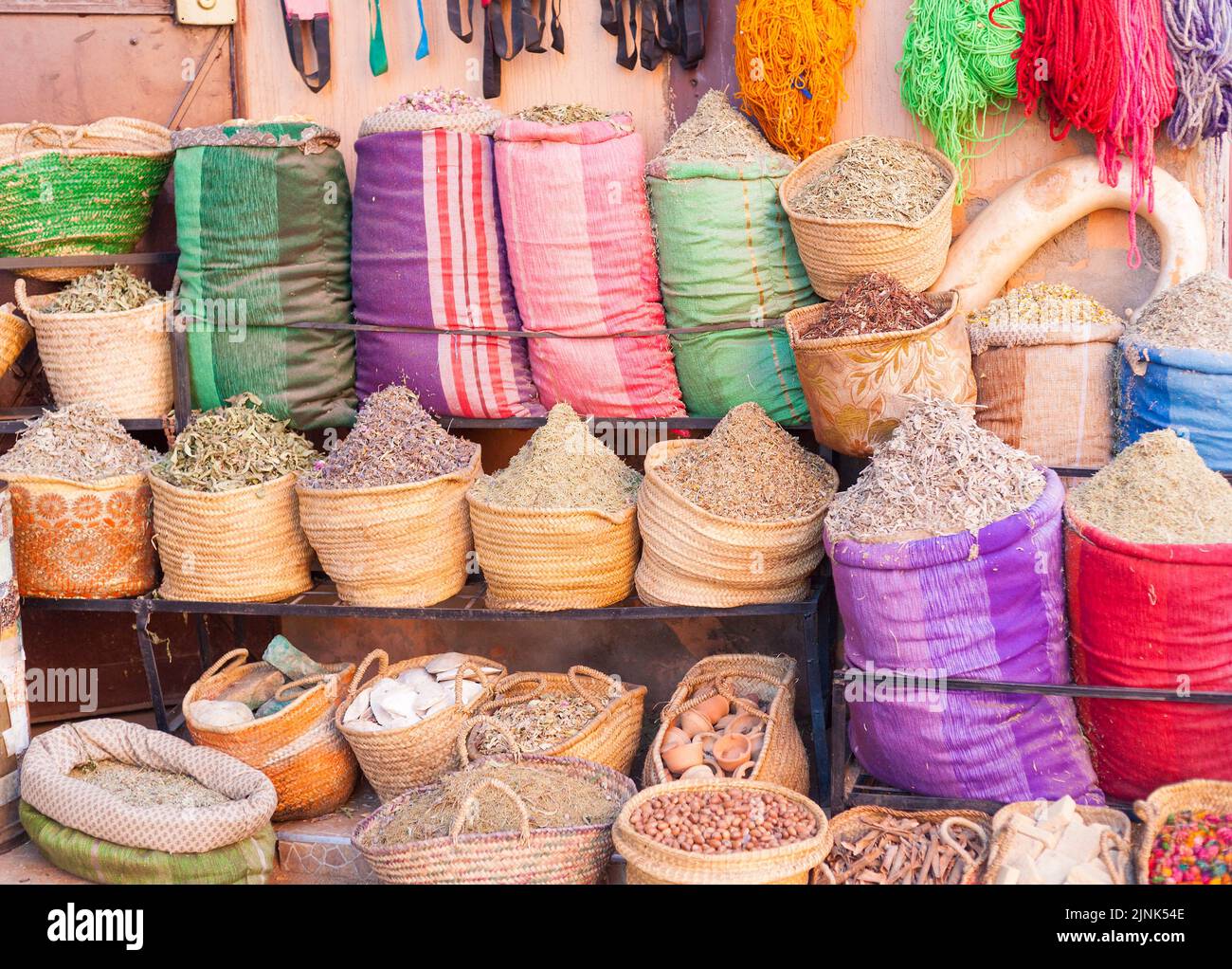 Market stall at souk in Marrakesh offering mostly herbs Stock Photo