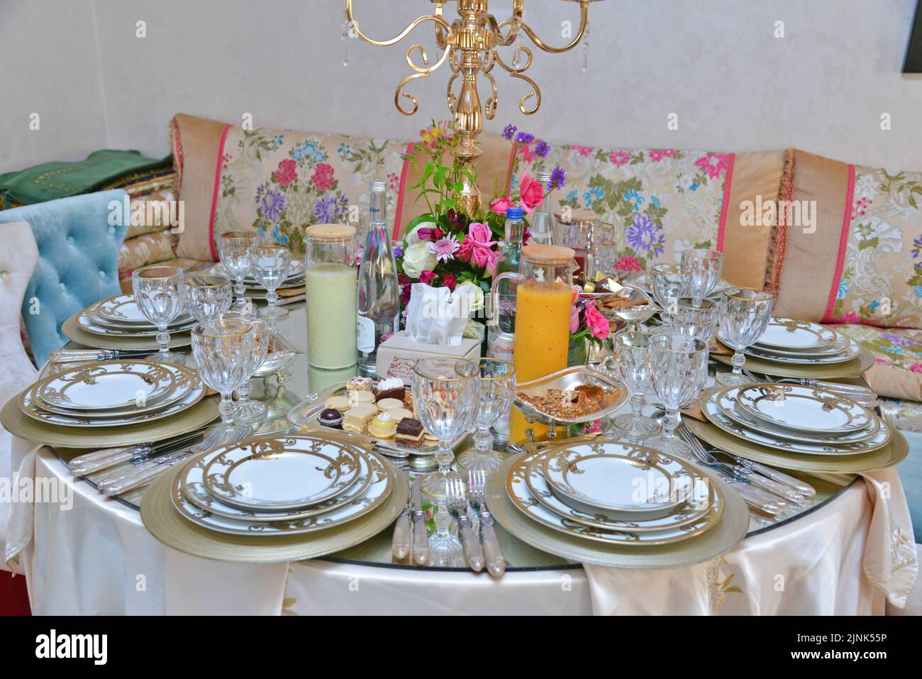 Moroccan salon with wedding table plates, cups and chairs Stock Photo