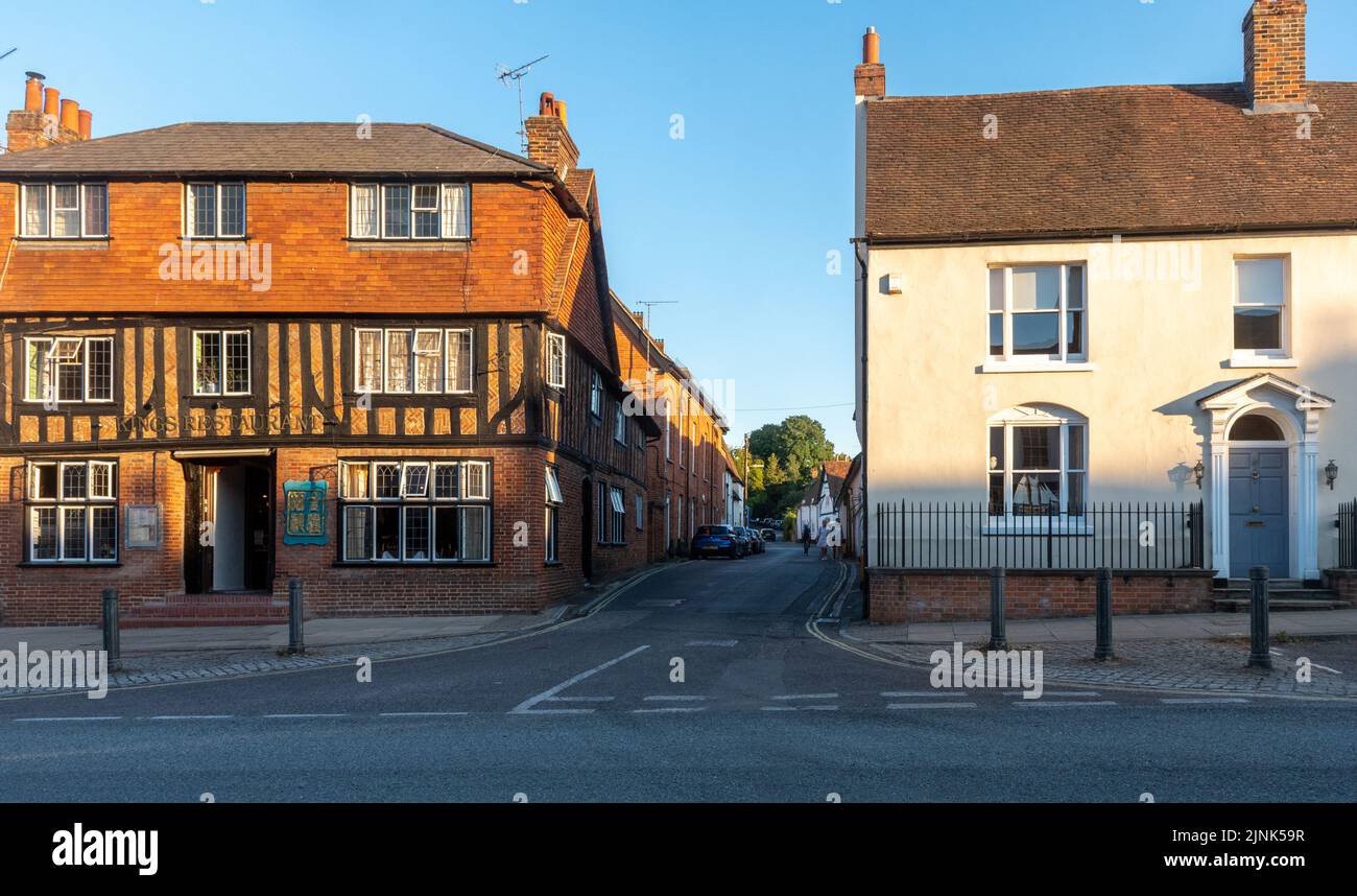 Odiham village, Hampshire, England, UK, on a sunny summer evening. Kings Restaurant on the High Street and view of King Street Stock Photo