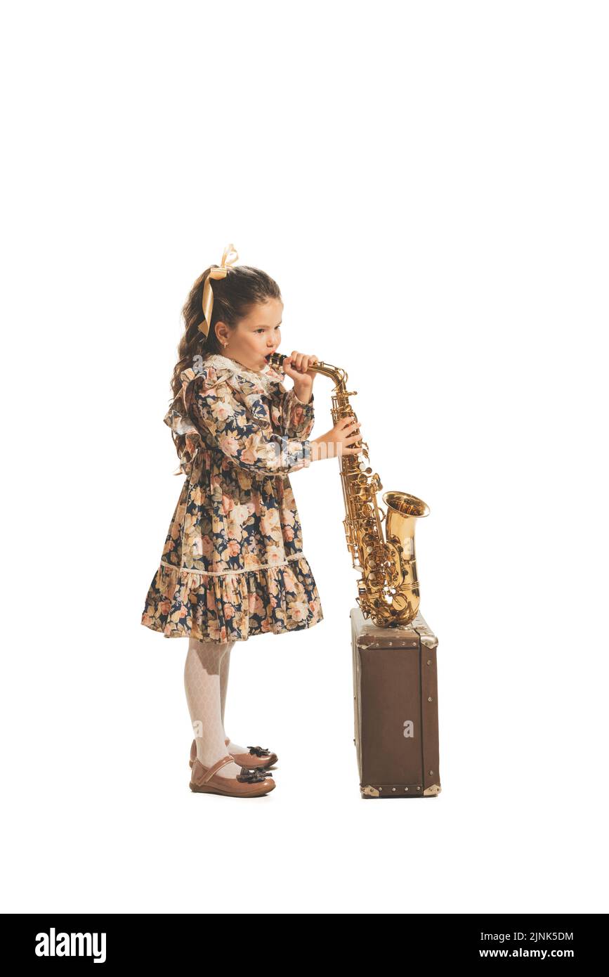 An Adorable Preschooler Playing A Toy Saxophone In A Sparkly Black Fedora  And Balck Leather Vest And Pants. On A White Background. Stock Photo,  Picture and Royalty Free Image. Image 16366730.
