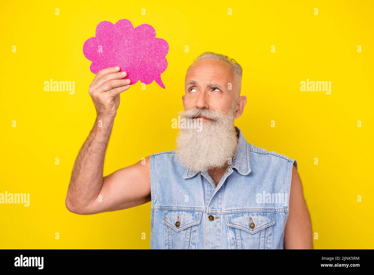 Photo of dreamy cute man pensioner dressed denim vest looking speaking bubble empty space isolated yellow color background Stock Photo