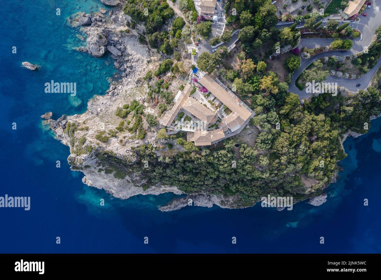Drone photo of peninsula with Monastery in Palaiokastritsa famous resort town on Greek Island of Corfu Stock Photo