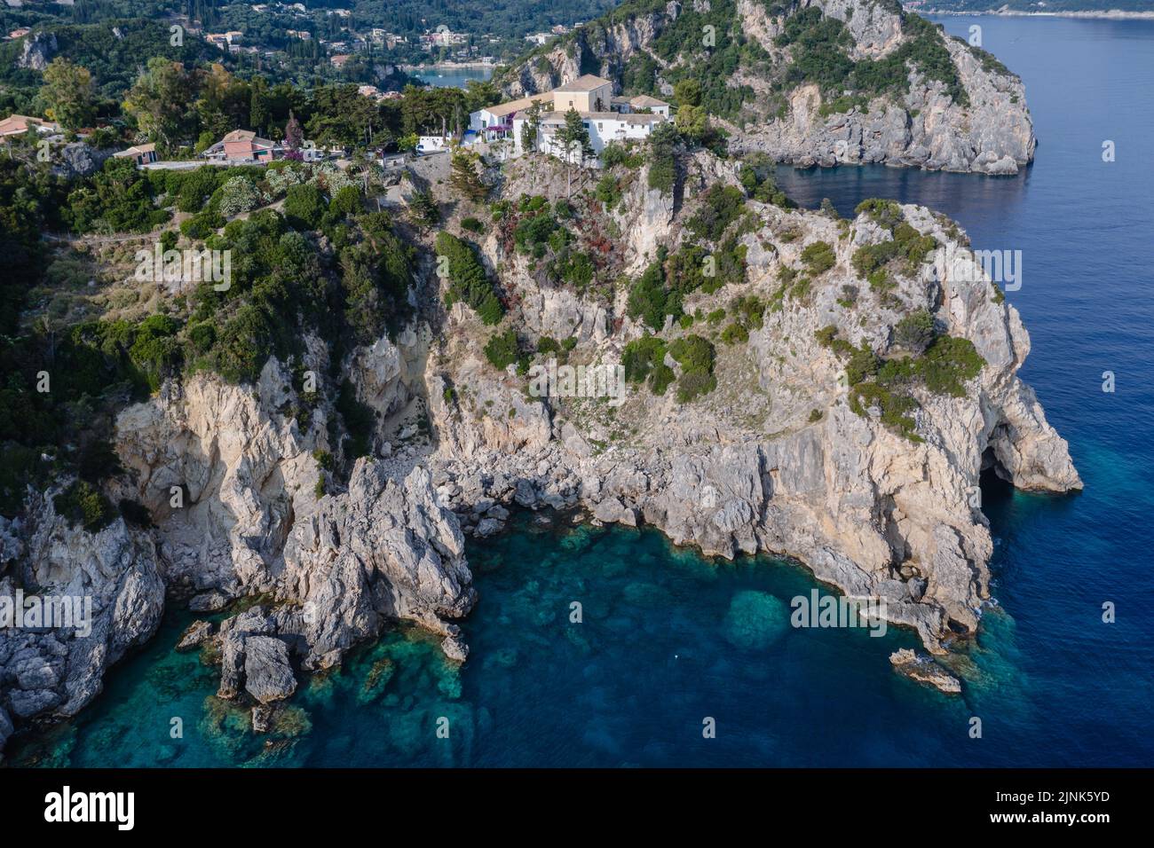 Aerial drone view with monastery in Palaiokastritsa famous resort town on Greek Island of Corfu Stock Photo