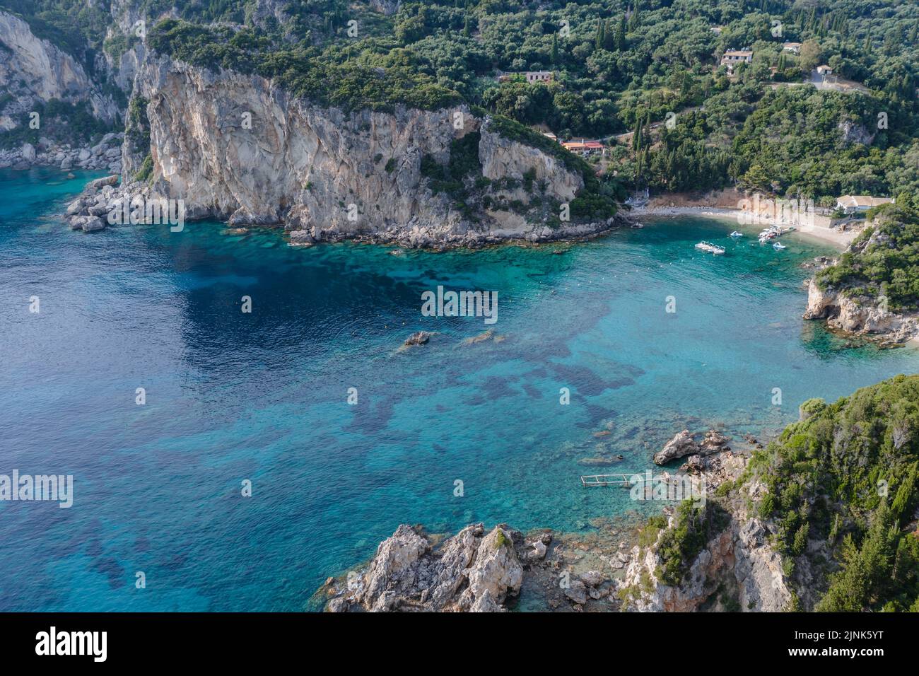 View with Ampelaki Beach in Palaiokastritsa famous resort town on Greek Island of Corfu Stock Photo