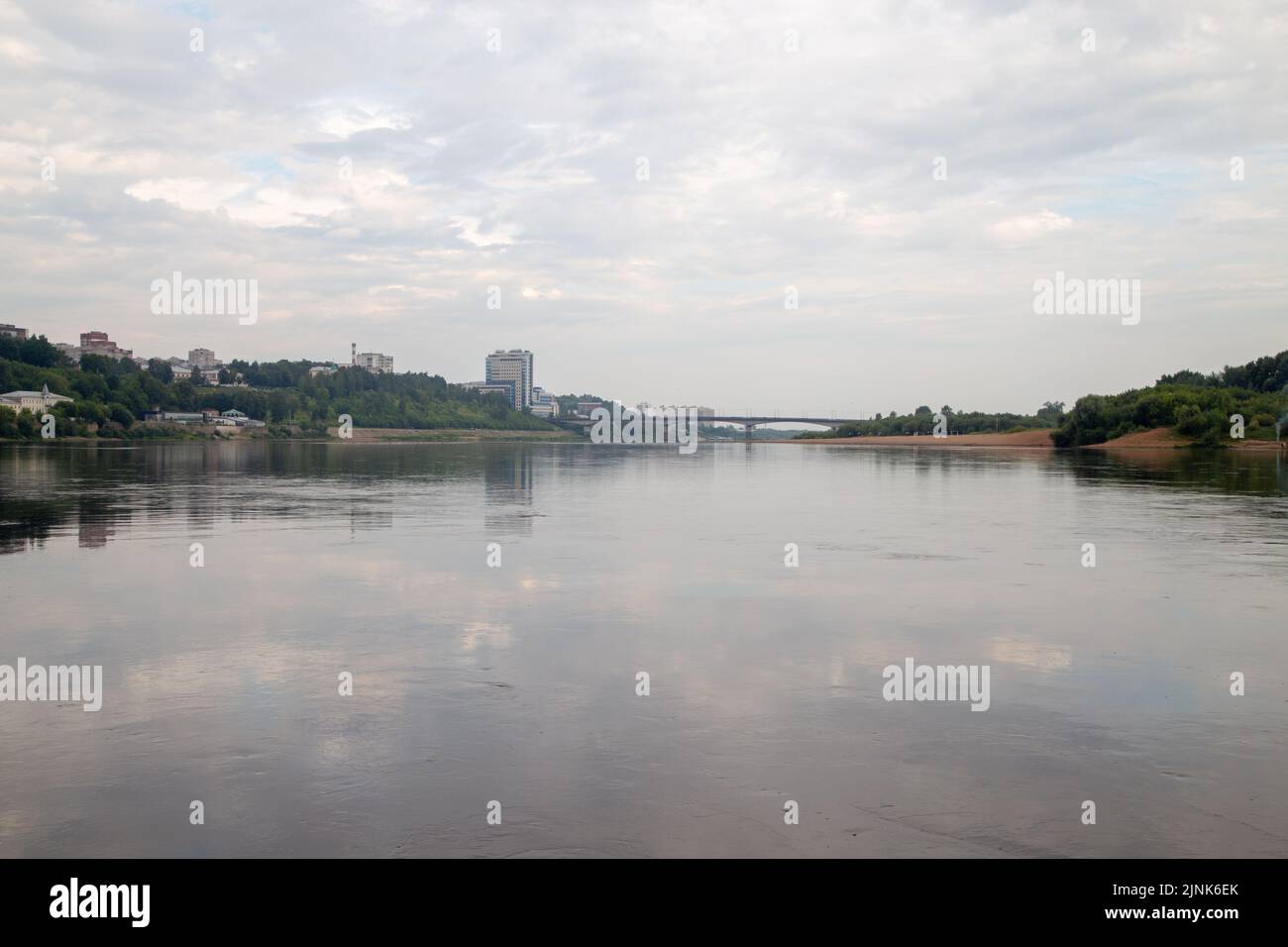 Photo of the city on the river in cloudy day in the summer Stock Photo