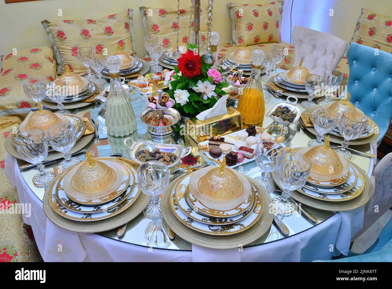 Moroccan salon with wedding table plates, cups and chairs Stock Photo
