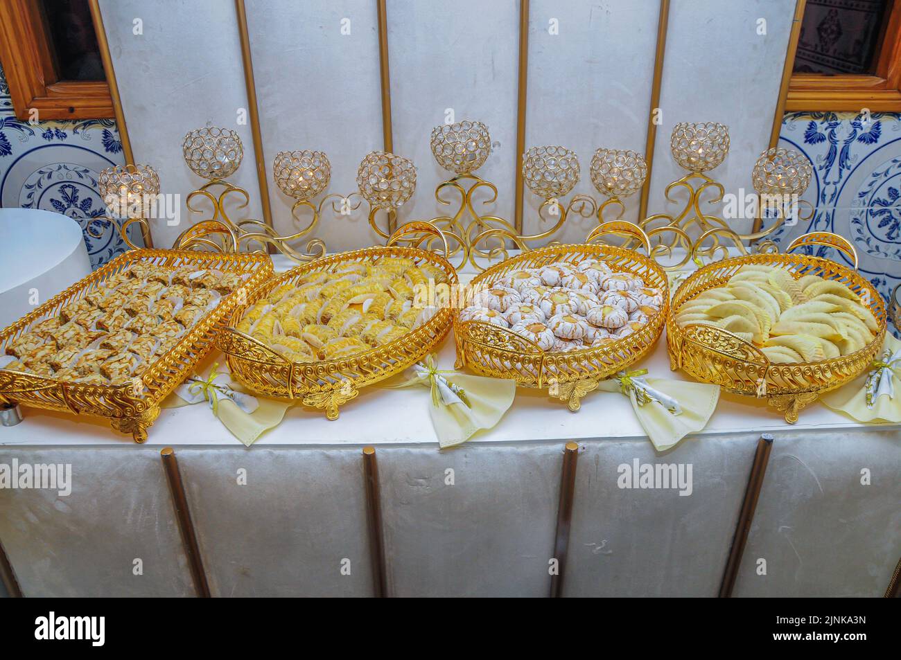 Moroccan biscuit buffet at the entrance of a Moroccan wedding hall Stock Photo