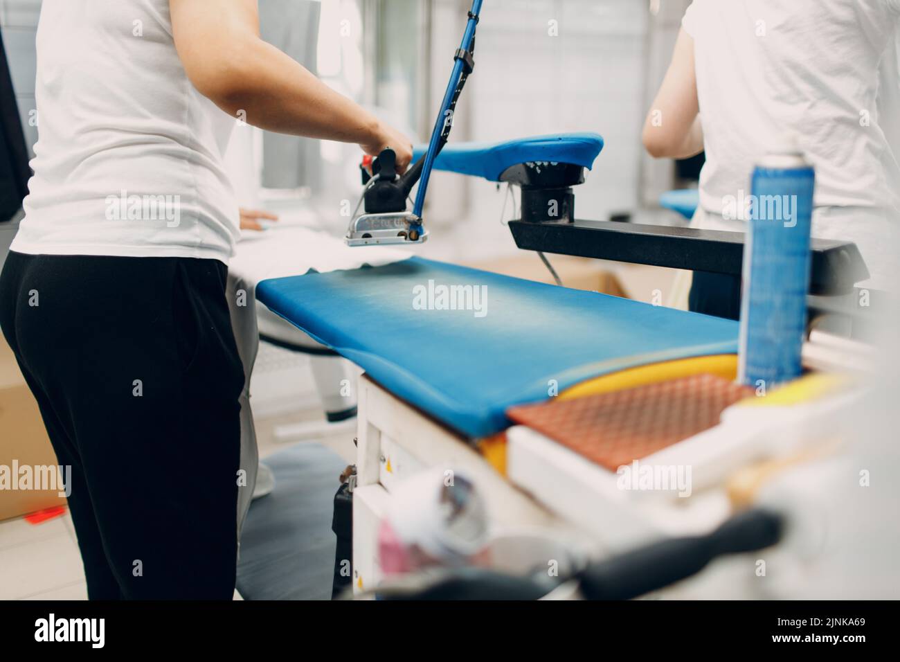 Dry cleaning iron clothes. Clean cloth chemical process. Laundry