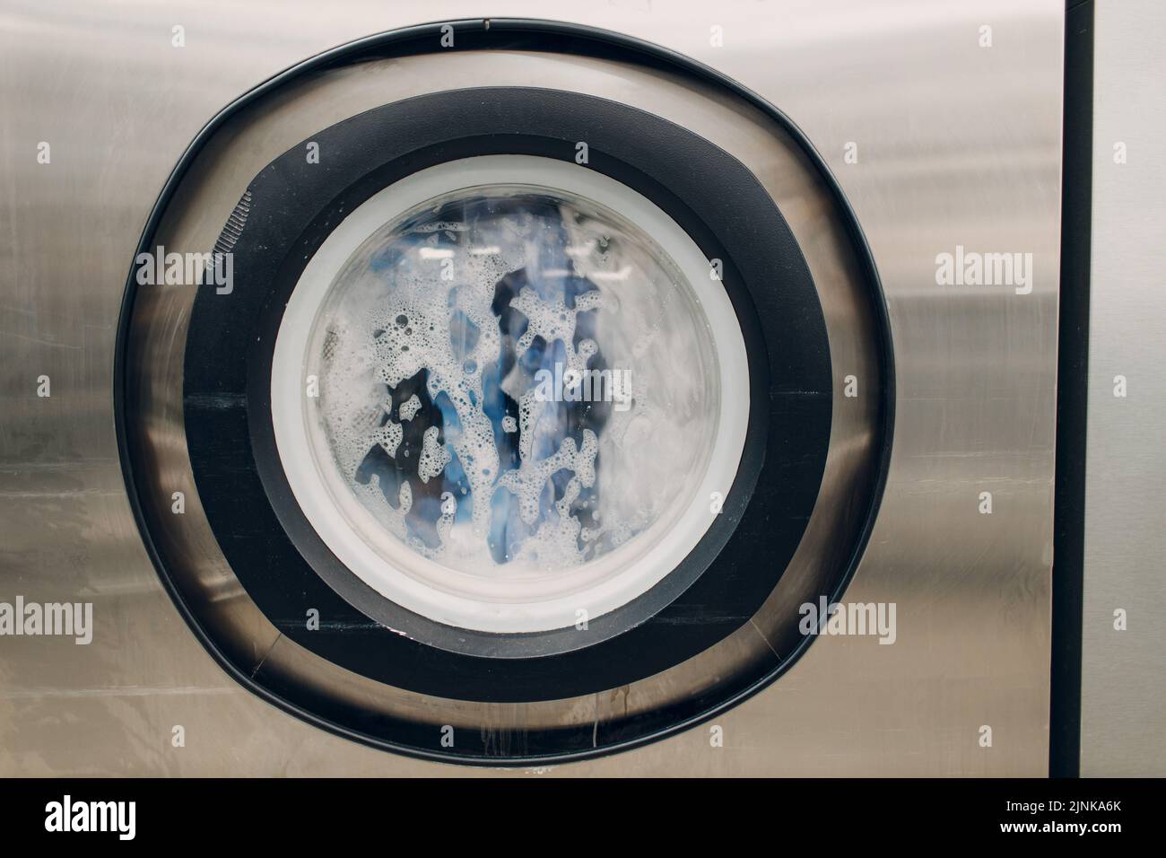 Dry cleaning clothes. Clean cloth chemical process. Laundry industrial