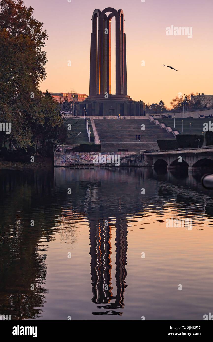 The unknown heroes monument in carol park, Bucharest, Romania reflected in the lake Stock Photo