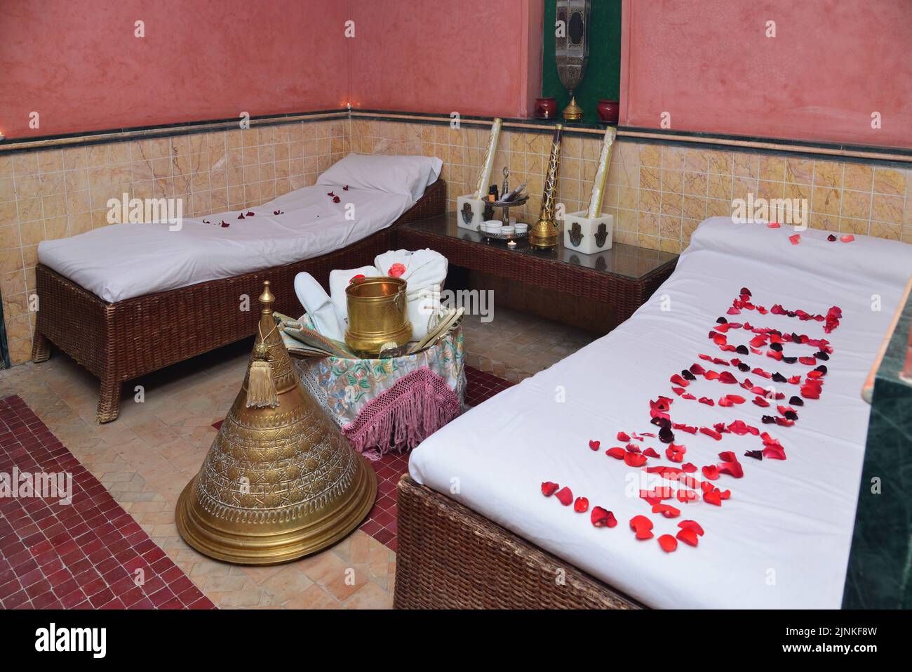 Moroccan bath and spa with roses above the bed Stock Photo