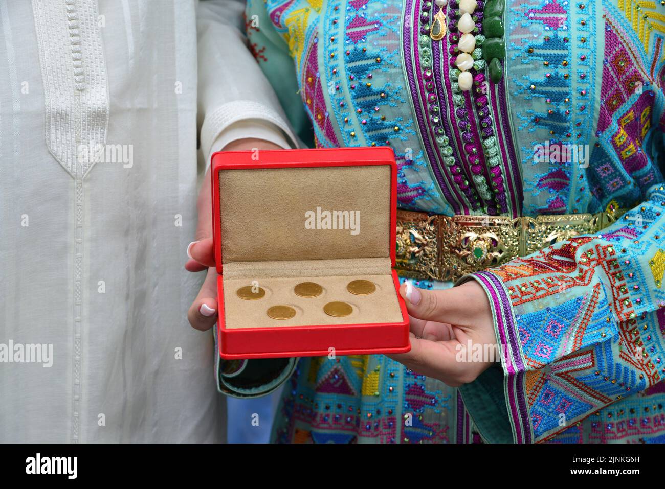 Moroccan groom and bride holding wedding jewelry Stock Photo