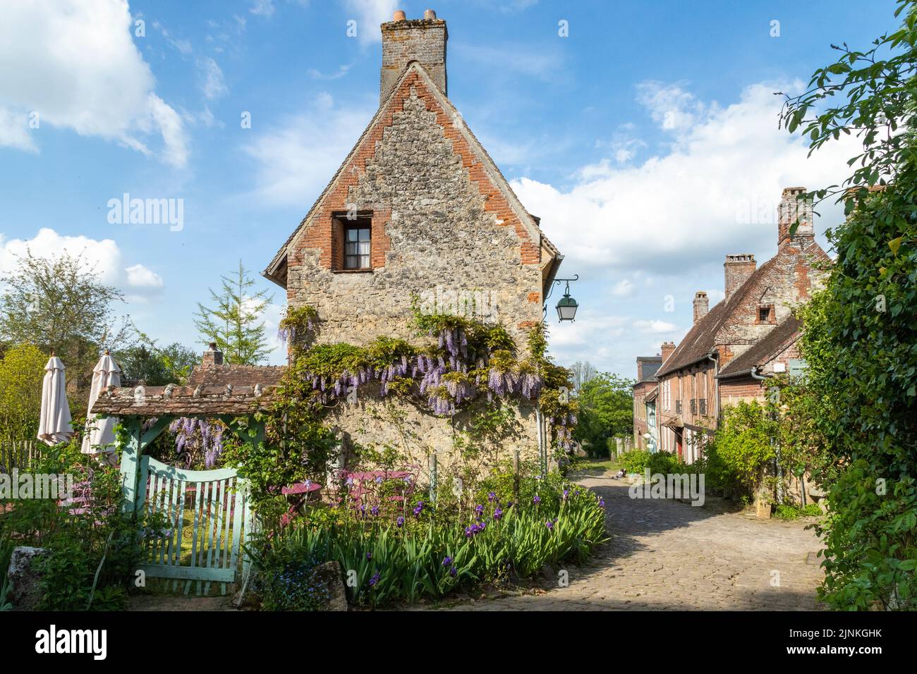 France, Oise, Picardie, Pays de Bray, Gerberoy, labelled Les Plus Beaux Villages de France (The Most Beautiful Villages of France), flowery street // Stock Photo