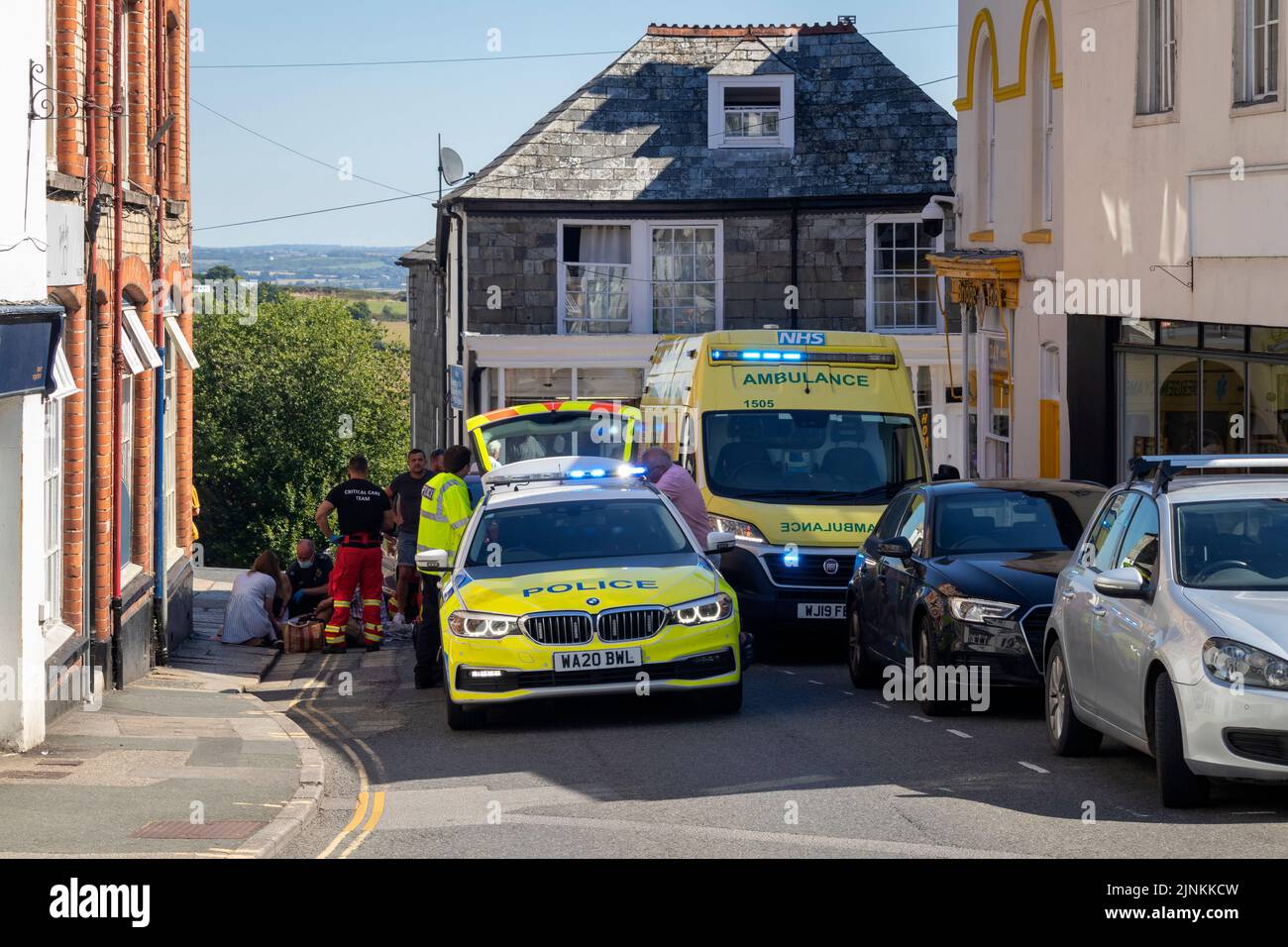 A pedestrian stepped into the road and was knocked over by a car, (casualty conscious & talking). The police, ambulance and air ambulance responded. Stock Photo