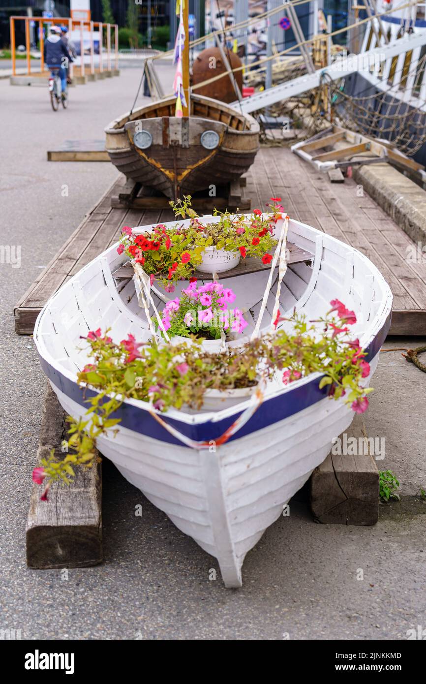 Small decorative boat with flowers and plants inside Stock Photo Alamy