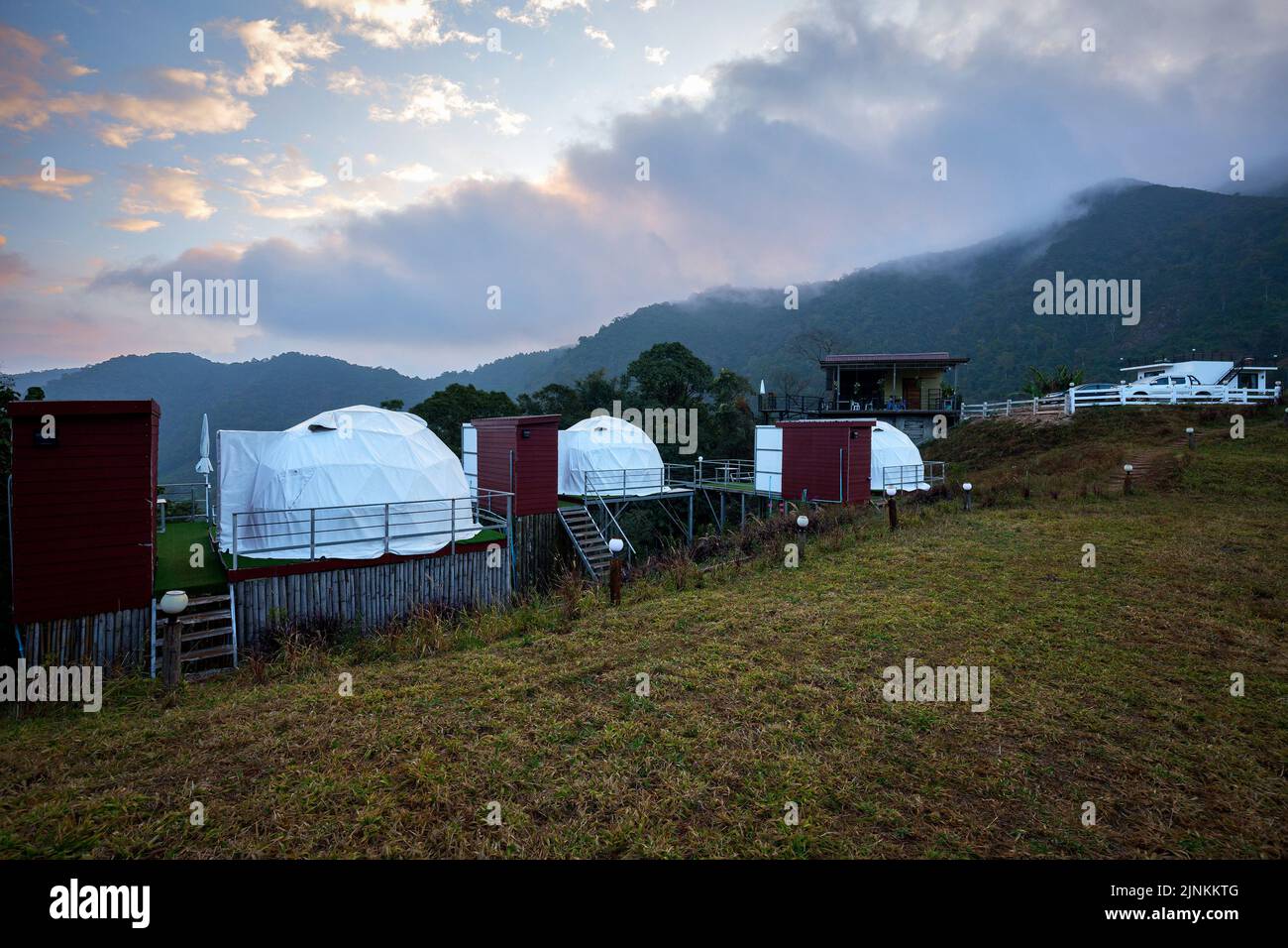 white dome tent a modern design for living lifestyle and farm with green location near mountain background nature Stock Photo