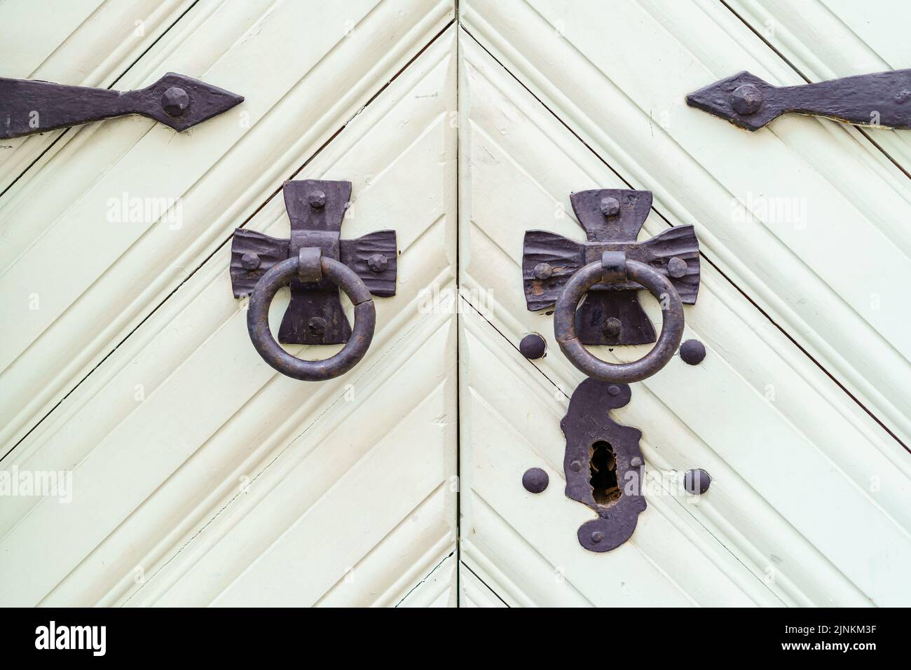 White wooden door with lock and black metal hardware Stock Photo - Alamy