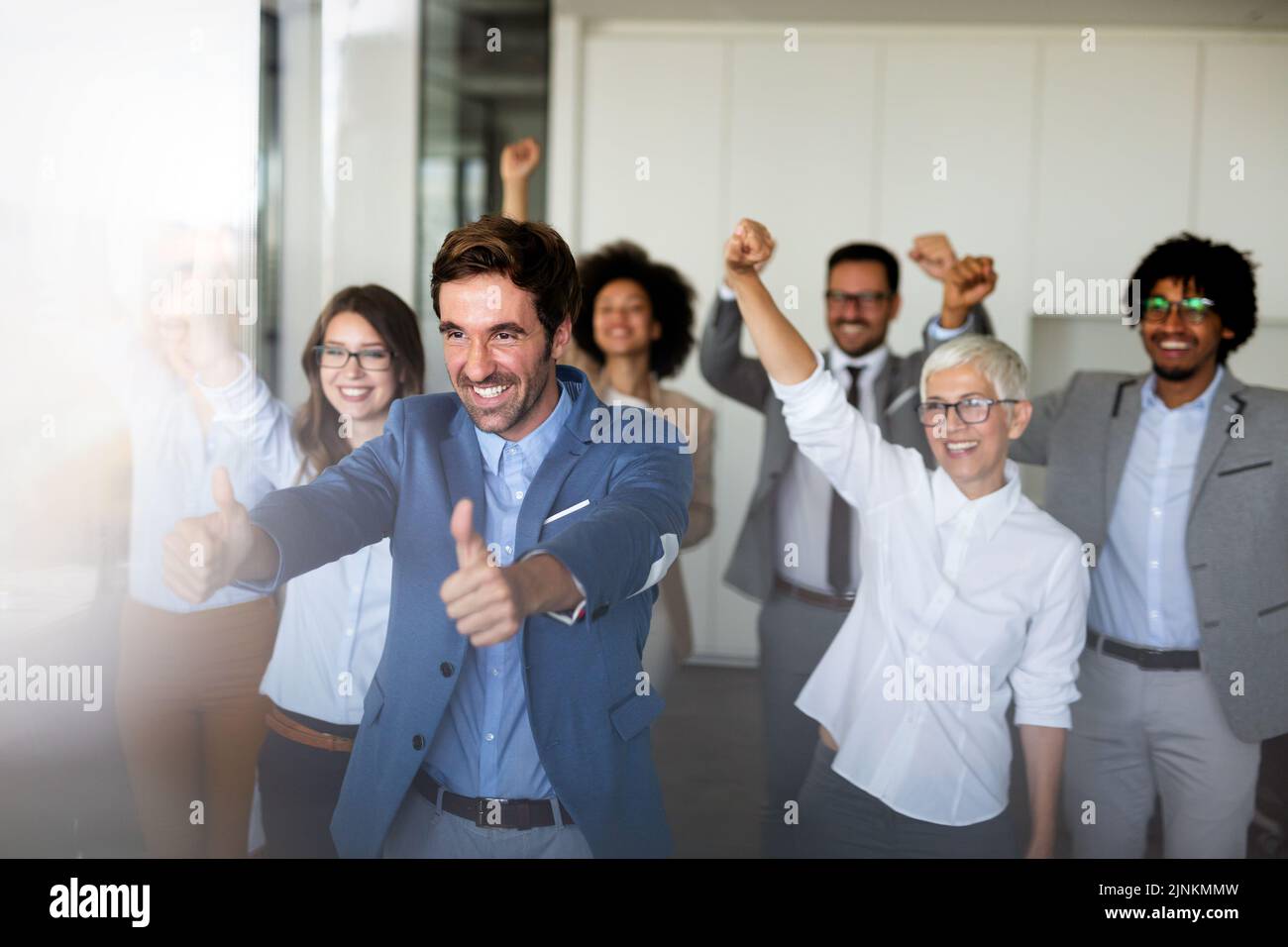 Happy group of business team celebrating a good job in the office ...