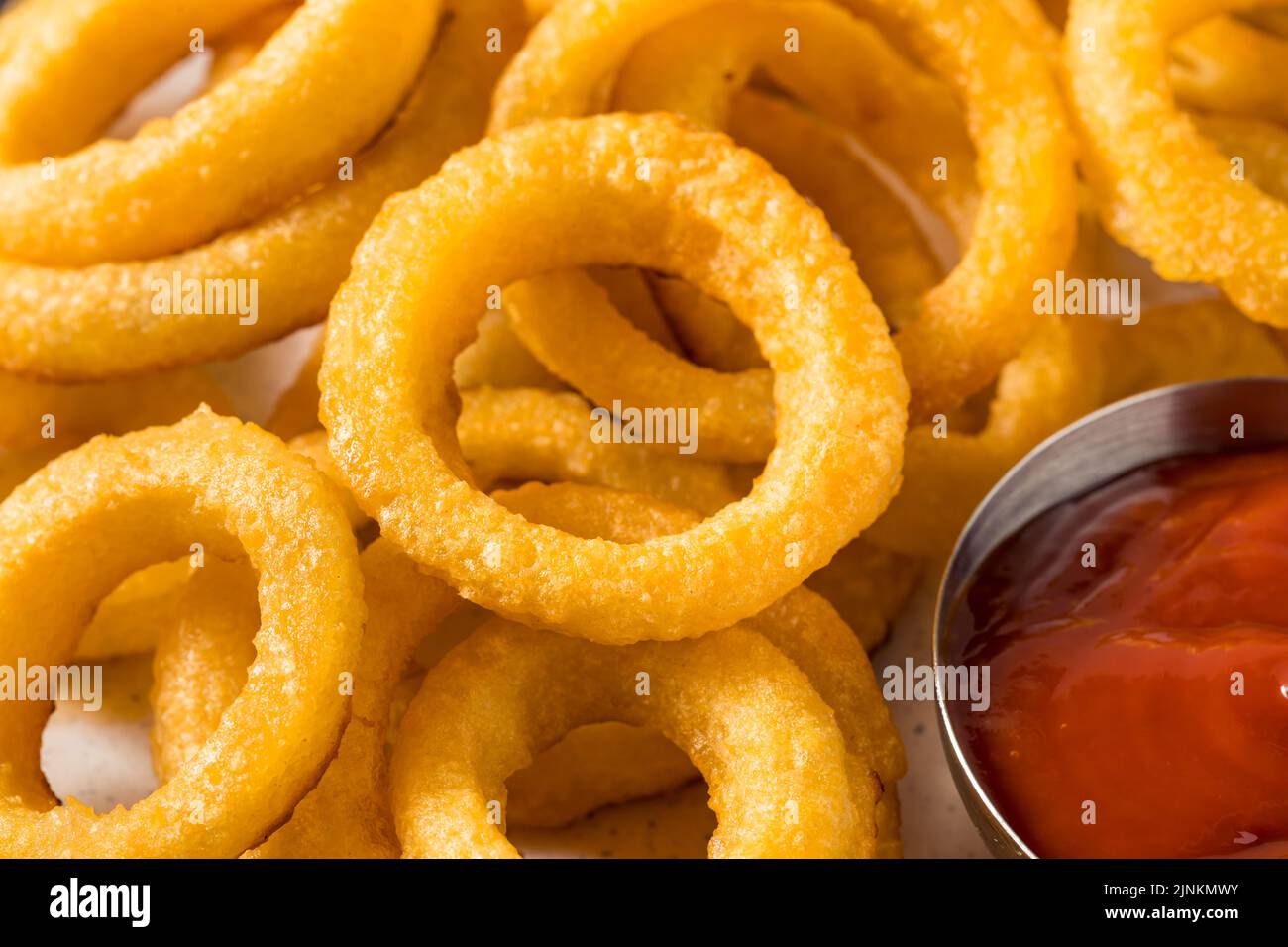 Homemade Battered Onion Rings with Ketchup Sauce Stock Photo