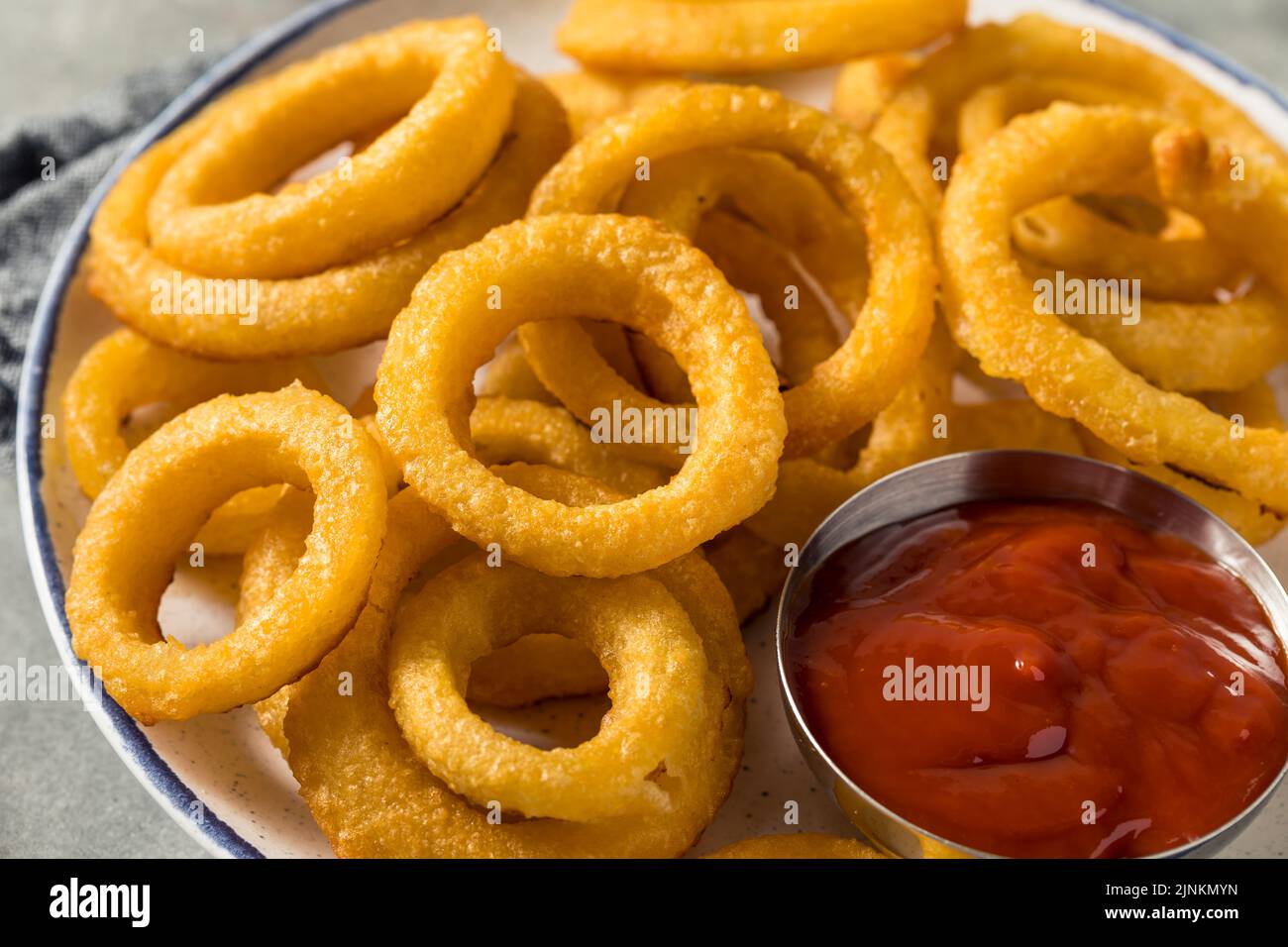 Homemade Battered Onion Rings with Ketchup Sauce Stock Photo