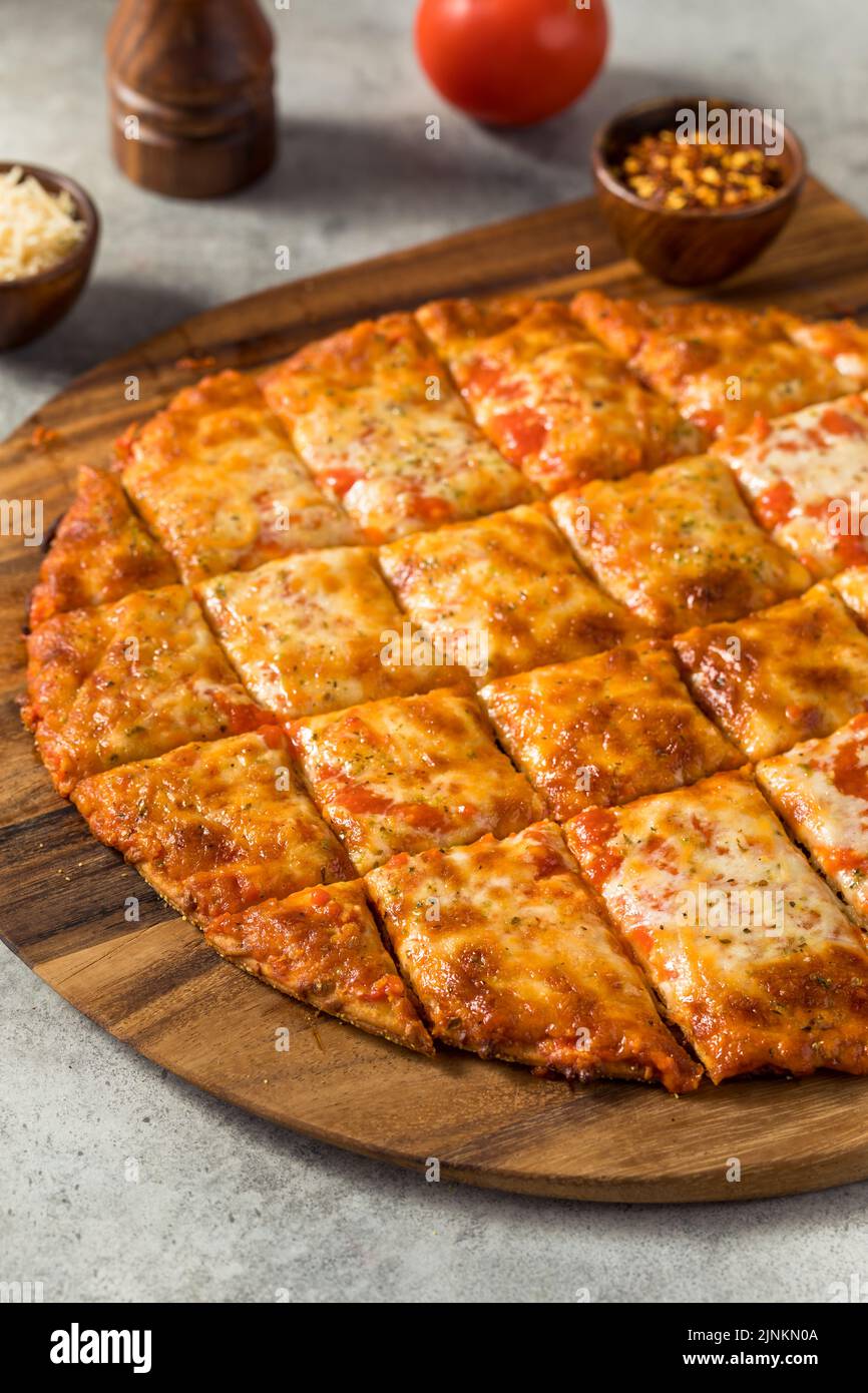 Homemade Tavern Style Cut Cheese PIzza Ready to Eat Stock Photo