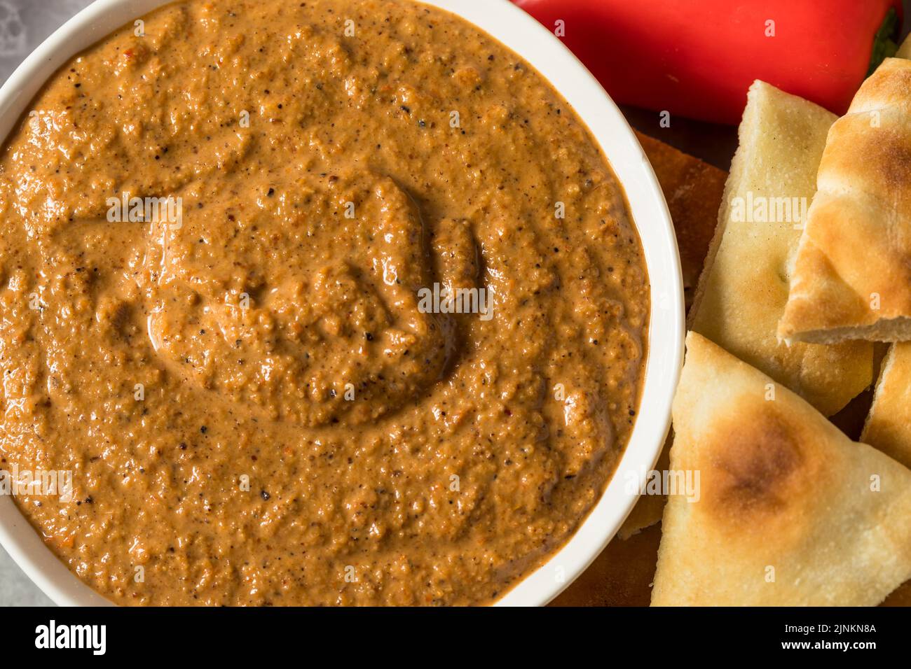 Healthy Homemade Muhammara Dip with PIta and Peppers Stock Photo