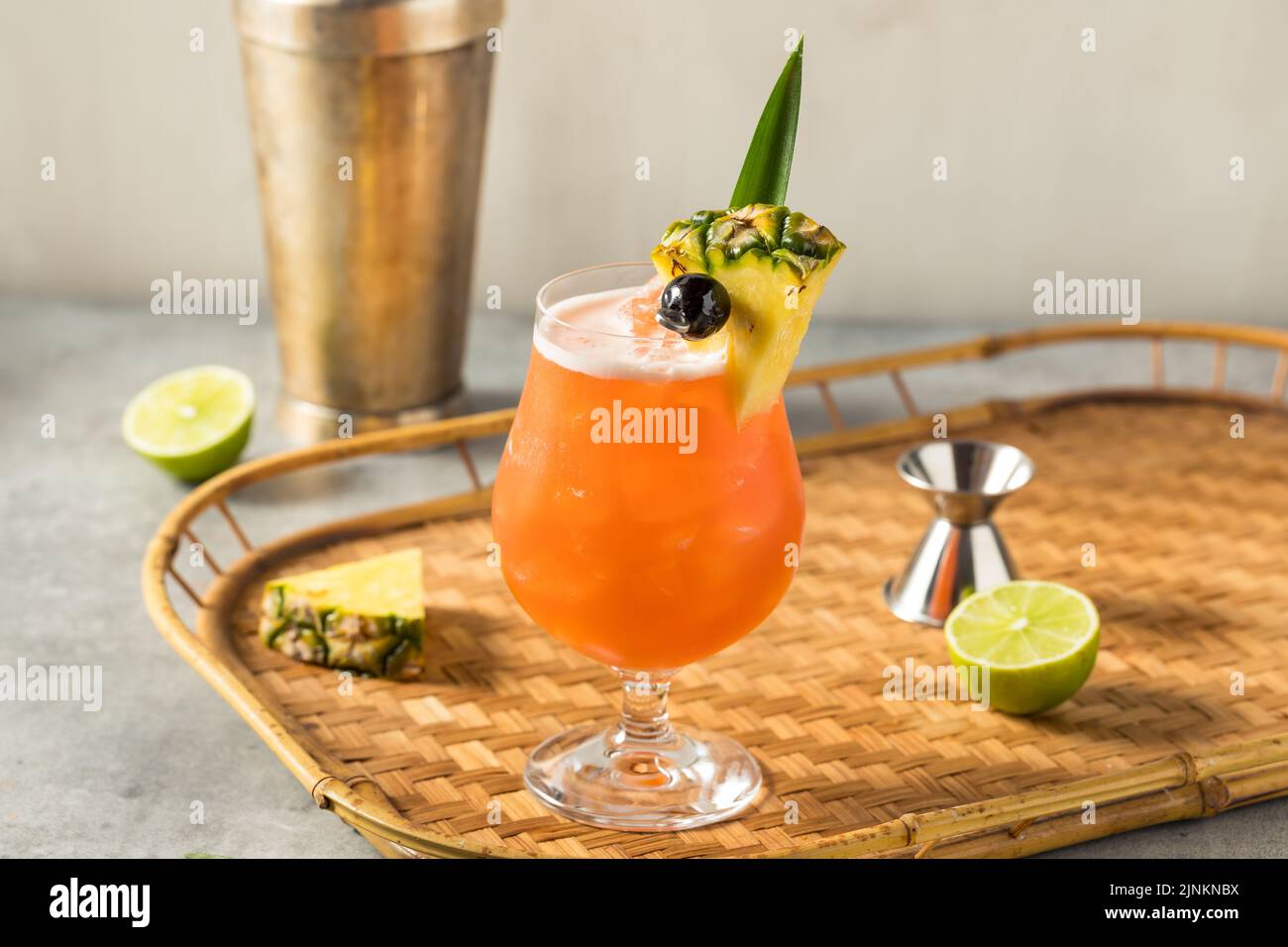 Boozy Cold Rum Runner Cocktail with Cherry and PIneapple Stock Photo