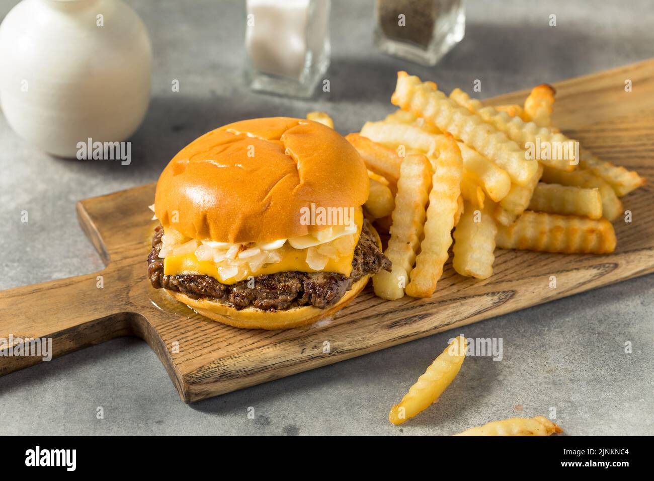 Homemade Wisconsin Butter Burger with Cheese and Fries Stock Photo