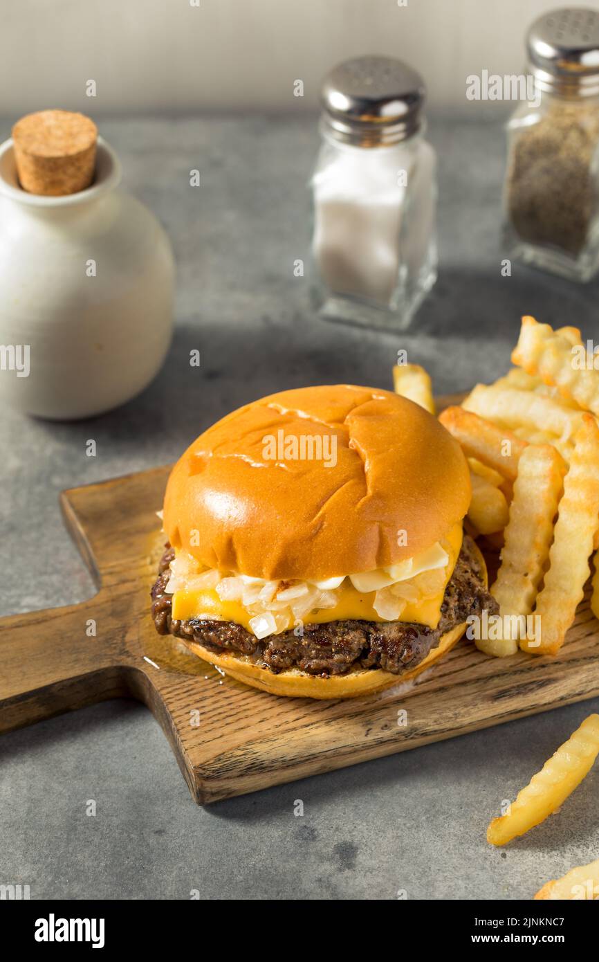 Homemade Wisconsin Butter Burger with Cheese and Fries Stock Photo