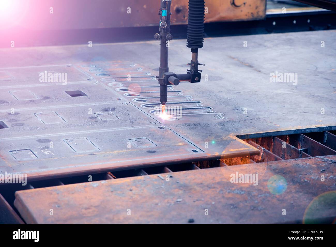 Laser cutting through hard material Stock Photo