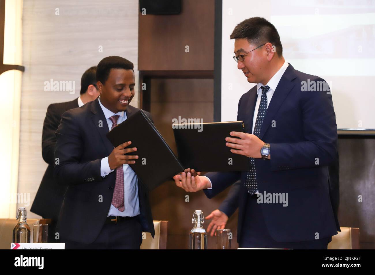 Addis Ababa, Ethiopia. 10th Aug, 2022. Representatives from the Ethiopian Investment Commission (EIC) and China's WODA Metal Industry Private Limited Company (PLC) hand over the agreement in Addis Ababa, Ethiopia, on Aug. 10, 2022. The Ethiopian Investment Commission (EIC) on Wednesday signed an agreement with China's WODA Metal Industry Private Limited Company (PLC) and its partners to build an industrial park in Ethiopia. Credit: Michael Tewelde/Xinhua/Alamy Live News Stock Photo