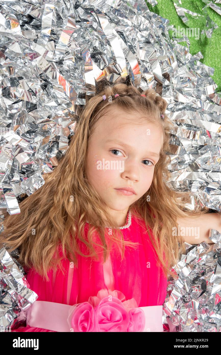 Girl blowing up balloon at party hires stock photography and images