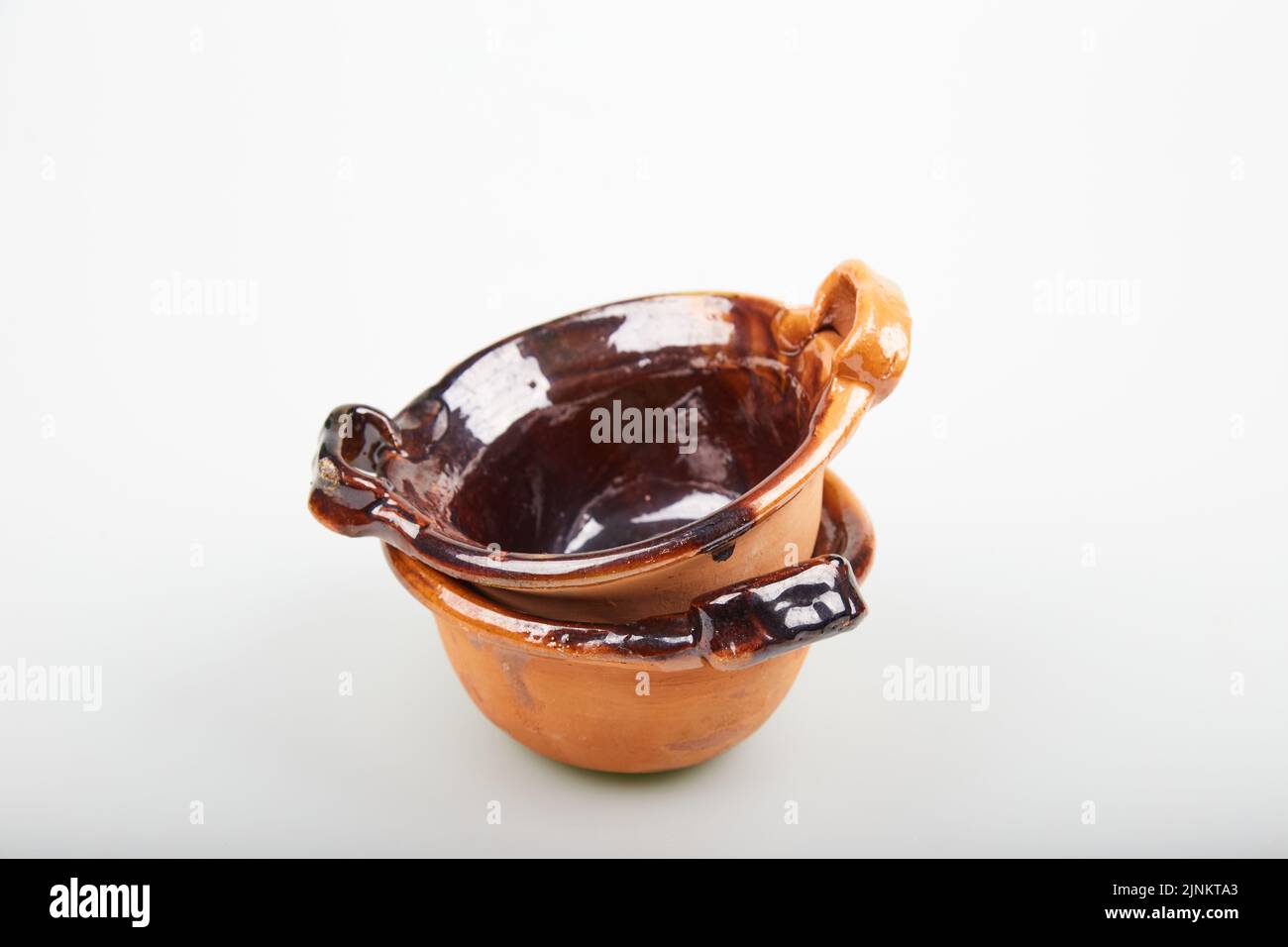 Ceramic clay pots (cassoles) isolated on white background Stock Photo