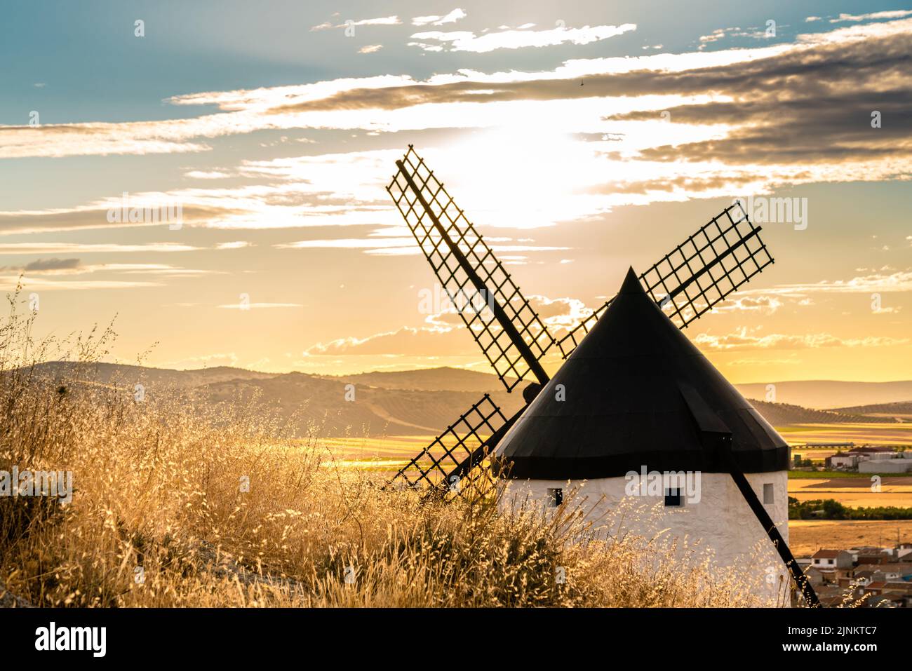 Old windmill photographed at golden hour. Sun in front of the camera ...