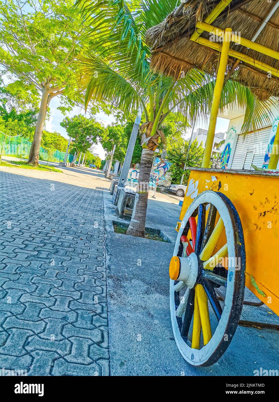 Drivable orange tropical juice shop on wheels in Playa del Carmen