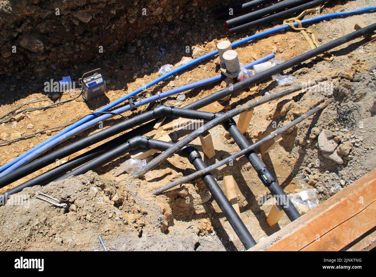 Supply line in an excavation pit Stock Photo