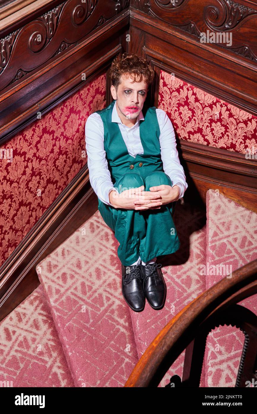sitting, lonely, hopeless, stairway, clown, actor, lonelies, desperate, hopelessness, stairways, clowns, actors Stock Photo