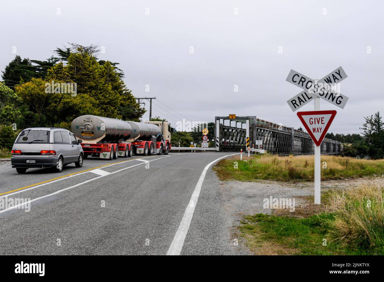 Traffic stopped on State Highway 6 south of Greymouth at a 'one-way' bridge that also has a rail track. West coast on South Island in New Zealand Stock Photo