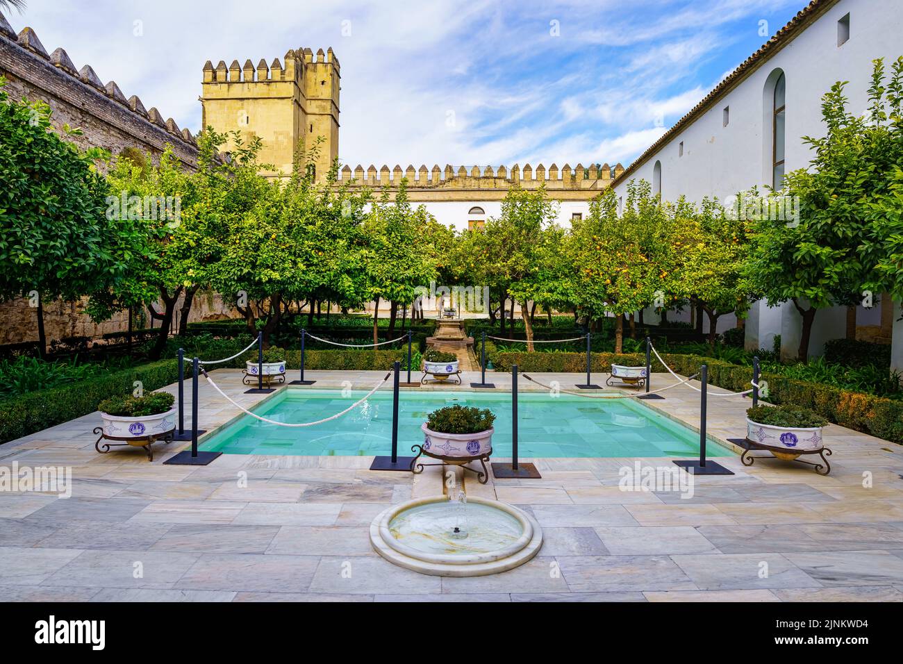 Patio With Fountains And Orange Trees Next To The Wall Of The Alcazar patio-with-fountains-and-orange-trees-next-to-the-wall-of-the-alcazar