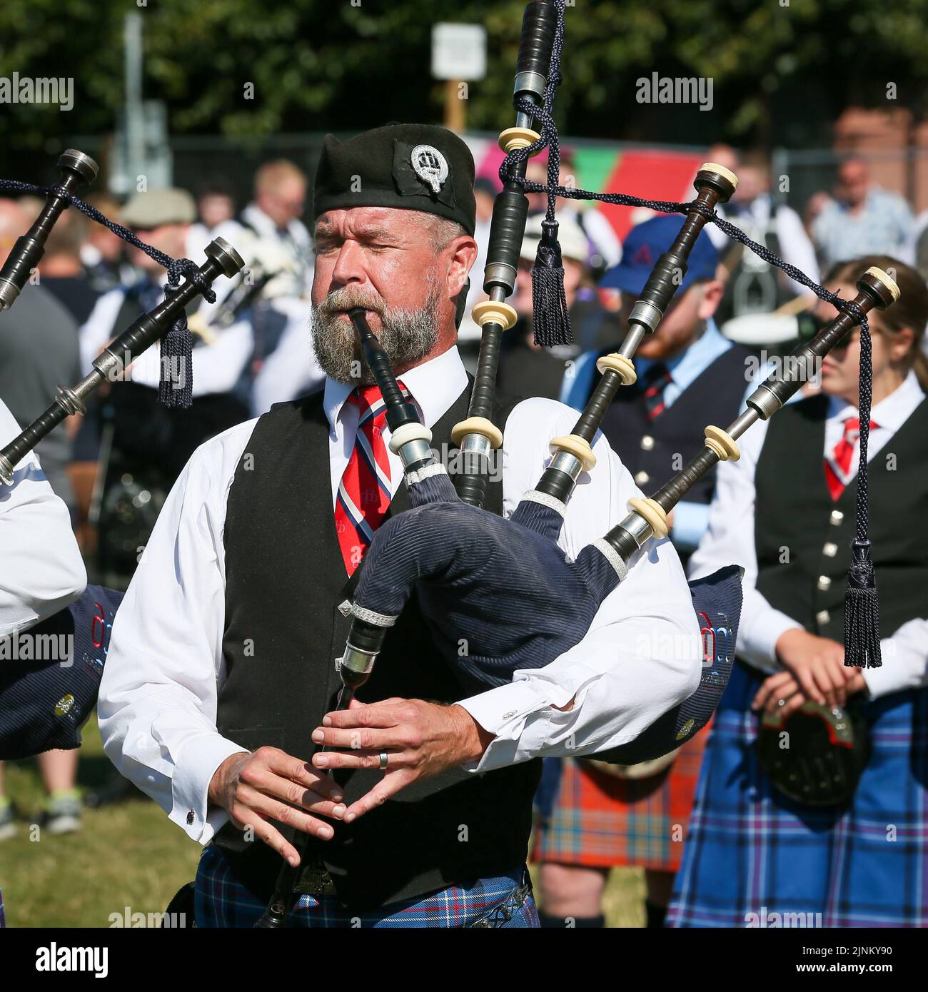 Glasgow, UK. 12th Aug, 2022. The World Pipe Band Championship has been reinstated after being suspended in 2019 because of Covid restrictions, and this year 150 pipe bands from around the world are taking part. The competition takes place over 2 days, and on the second day (Saturday), because of warm and sunny weather, it is expected to attract record crowds. Credit: Findlay/Alamy Live News Stock Photo